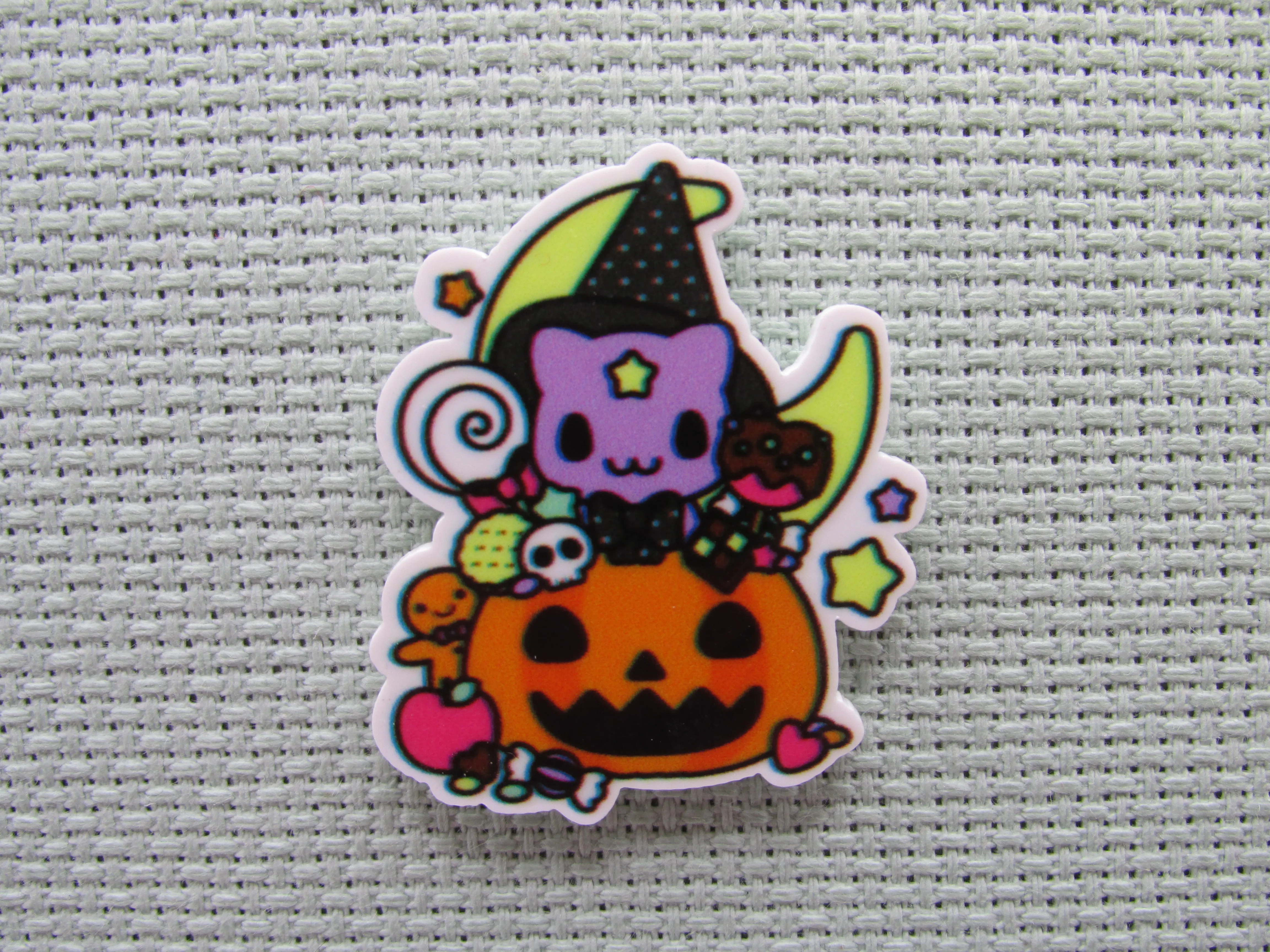 Purple Cat Wearing a Witch's Hat in a Carved Pumpkin full of Candy in Front of a Moon Needle Minder, Cover Minder, Magnet